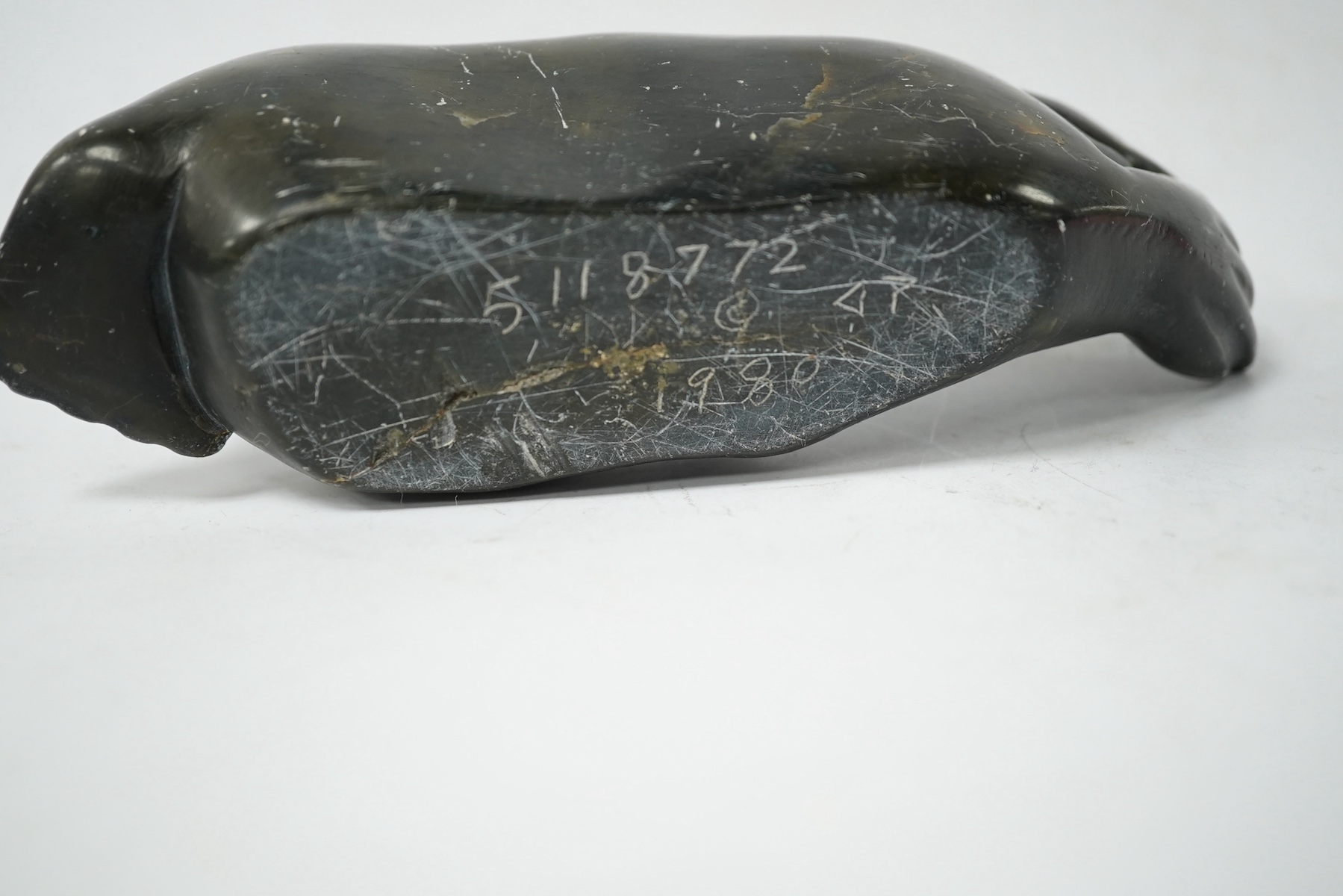 An Inuit soapstone carved seal sculpture, incised date 1980 to the base. Condition - fair